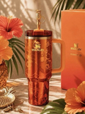 Orange tropical floral insulated tumbler with handle, straw and decorative design